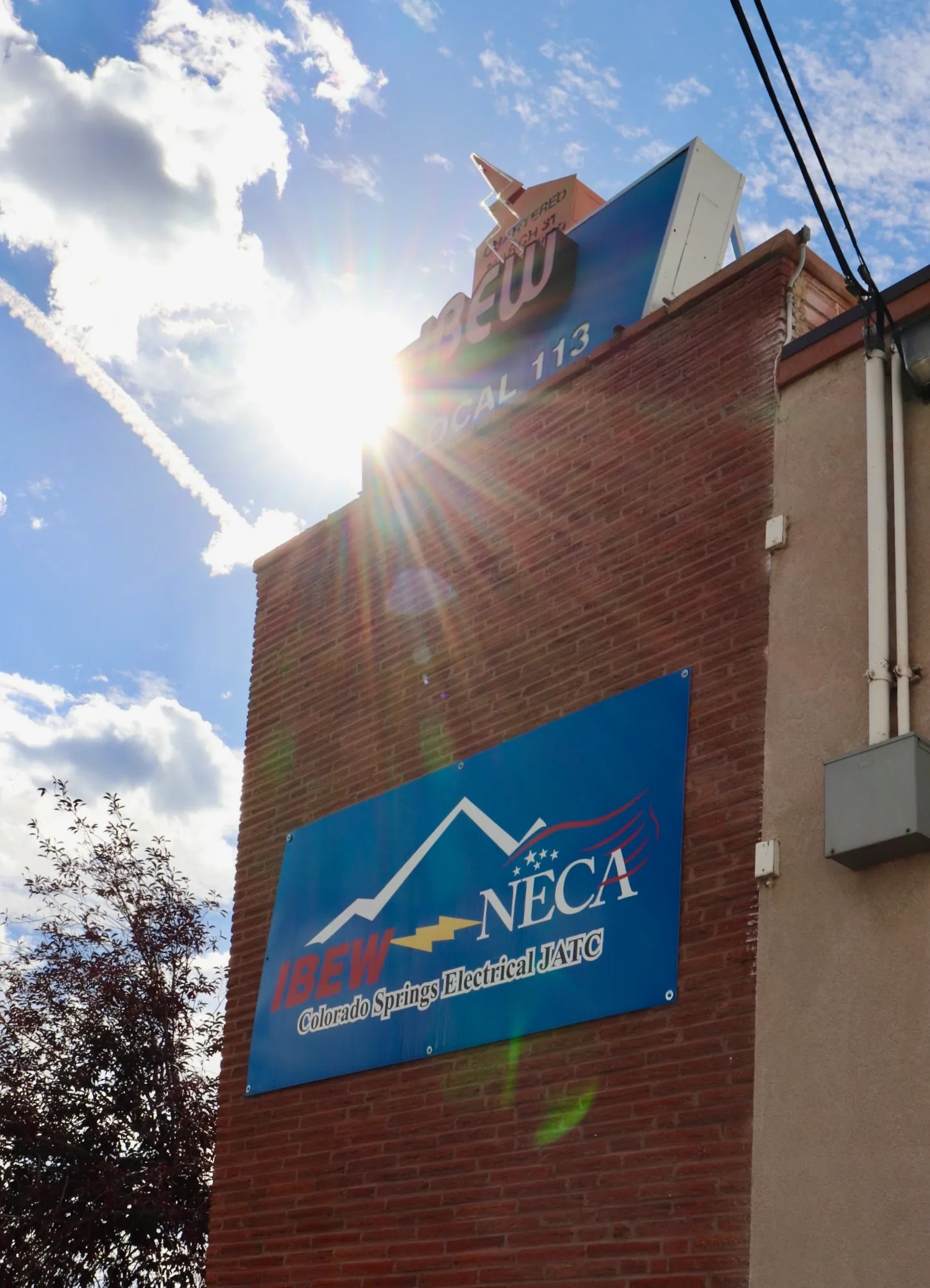 IBEW Local 113 and CSEJATC building sign with sun flare